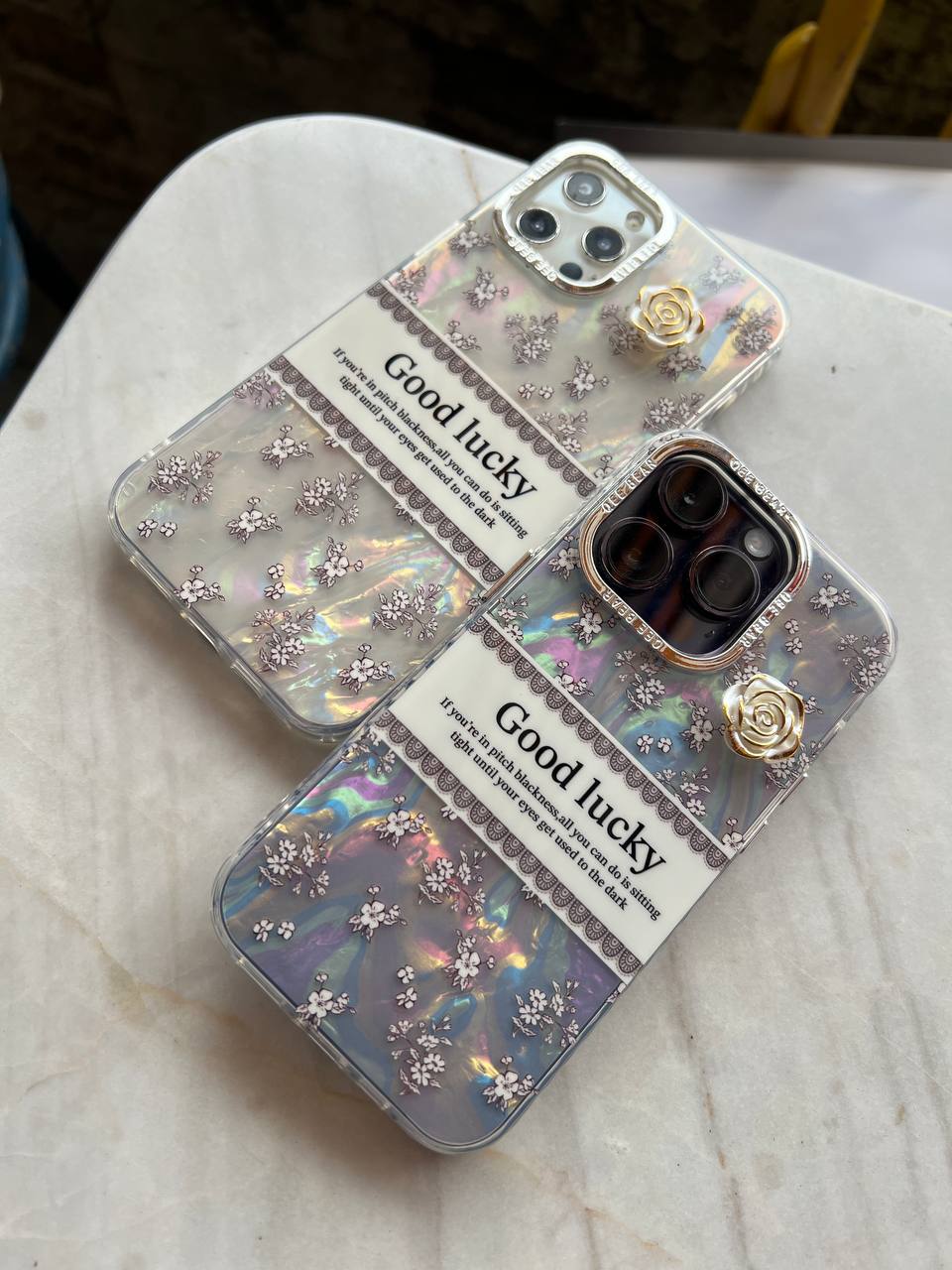 کاور هولوگرامی خوش شانس طرح گل آیفون با محافظ لنز